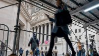 People walking along Wall Street in New York before President Trump's tarriff announcments