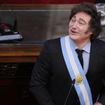 Argentine President Javier Milei smiles and looks up to his right during a session at the National Congress in Buenos Aires, Argentina.