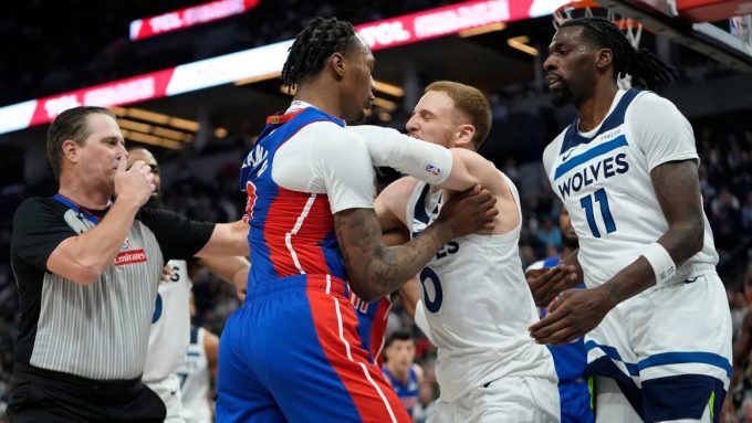 Pistons forward Ron Holland II and Timberwolves Donte DiVincenzo were two of the seven ejected from Sunday's game at the Target Center.