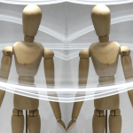 wooden artist's mannequin surrounded by trails of light. The photo is mirrored to create the two mannequins with their hands touching.