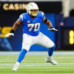 Chargers star LT Rashawn Slater carted off with apparent leg injury at practice