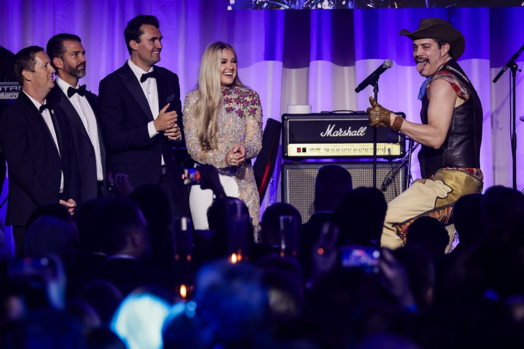 WASHINGTON, DC - JANUARY 19: (from left to right) Sergio Gor, Donald Trump Jr., Charlie Kirk, and Erika Frantzve watch on stage as The Village People perform YMCA during the Turning Point USA Inaugural-Eve Ball at the Salamander Hotel on January 19, 2025 in Washington, DC. (Photo by Samuel Corum/Getty Images) *** Local Caption *** Sergio Gor; Donald Trump Jr.; Charlie Kirk; Erika Frantzve
