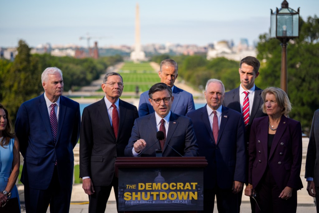 WASHINGTON, DC - OCTOBER 01: Speaker of the House Mike Johnson (R-LA) (C) leads a news conference with (L-R) U.S. Rep. Lisa McClain (R-MI), House Majority Whip Tom Emmer (R-MN), Senate Majority Whip John Barrasso (R-WY), Senate Majority Leader John Thune (R-SD), House Majority Leader Steve Scalise (R-LA), U.S. Sen. Tom Cotton (R-AR), and U.S. Sen. Shelley Moore Capito (R-WV) on the Upper West Terrace of U.S. Capitol Building on October 1, 2025 in Washington, DC. The government shut down early Wednesday after Congress failed to reach a funding deal. (Photo by Andrew Harnik/Getty Images)