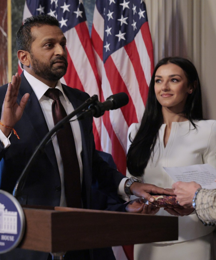 WASHINGTON, DC - FEBRUARY 21: U.S. Attorney General Pam Bondi swears in the new Federal Bureau of Investigation Director Kash Patel as his girlfriend Alexis Wilkins holds the Bhagavad Gita in the Indian Treaty Room in the Eisenhower Executive Office Building on February 21, 2025 in Washington, DC. Patel was confirmed by the Senate 51-49, with Sen. Susan Collins (R-ME) and Sen. Lisa Murkowski (R-AK) the only Republicans voting to oppose him. Patel has been a hard-line critic of the FBI, the nation’s most powerful law enforcement agency. (Photo by Chip Somodevilla/Getty Images)